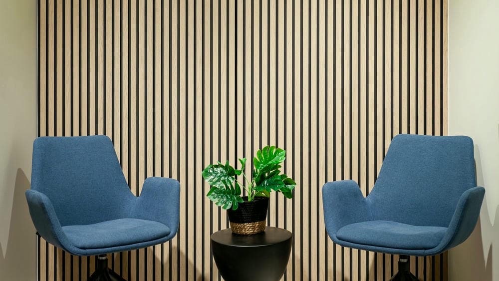 Fluted wall panels behind a modern seating nook